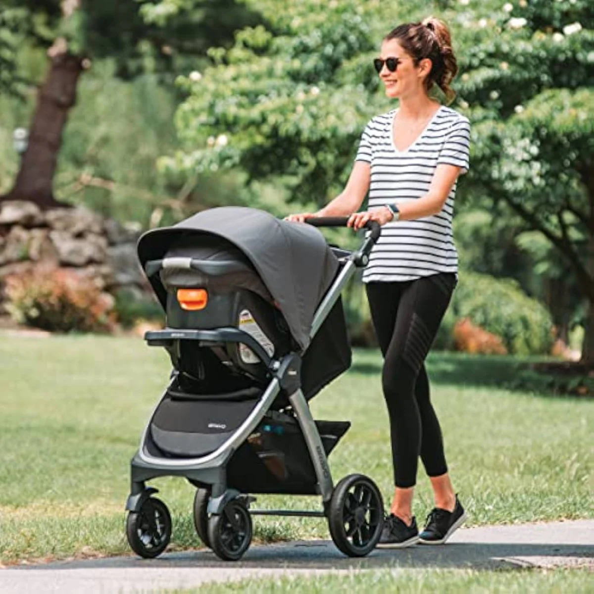 A full-size Chicco stroller with its own padded toddler seat and canopy