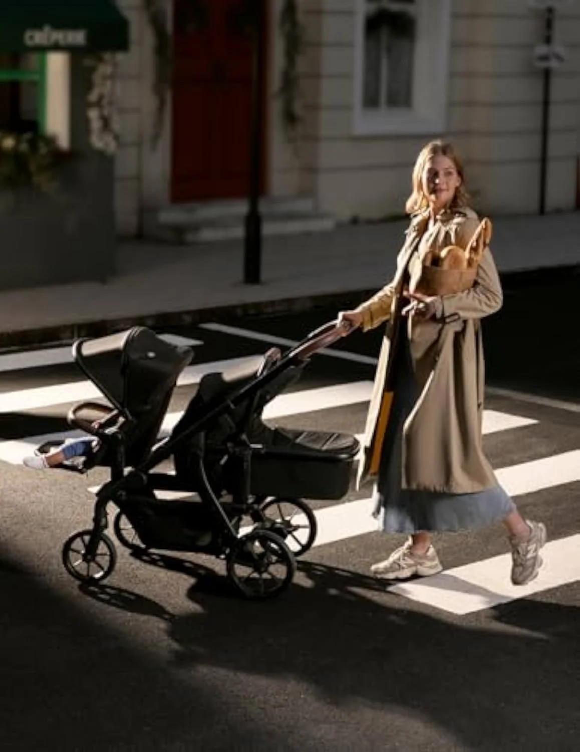 The Momcozy ChangeGo, a heavy convertible single-to-double stroller that must be gate-checked to fly